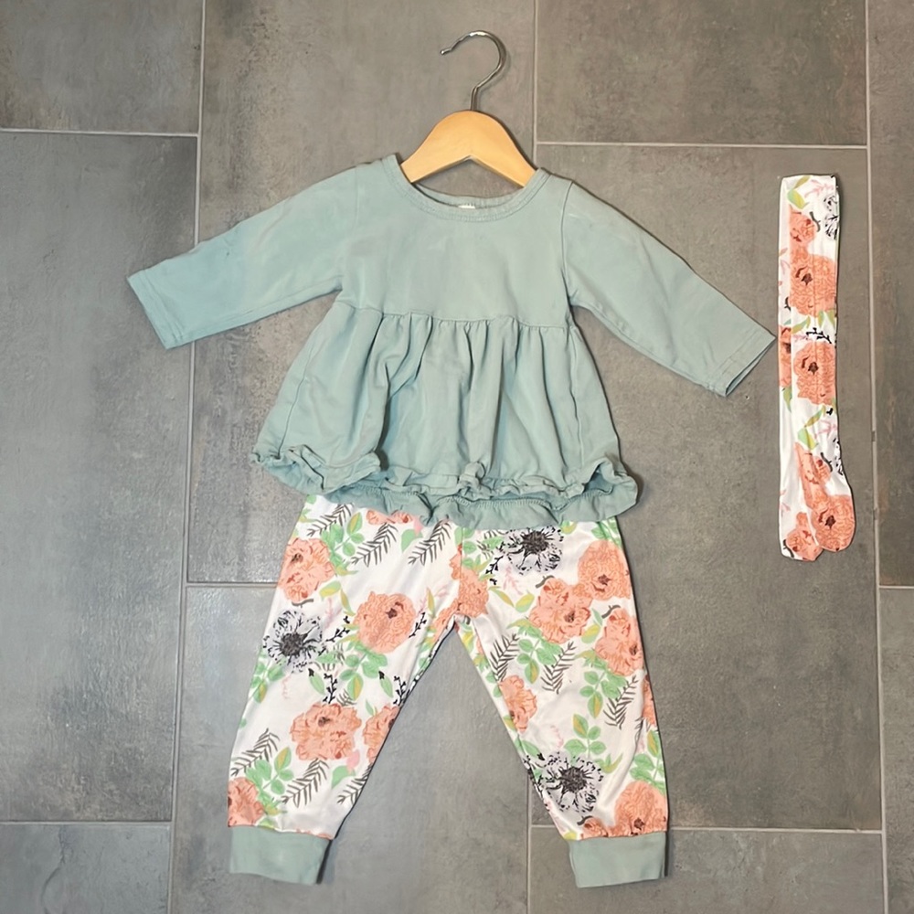 Full toddler outfit, light blue ruffle shirt with floral pants and headband
